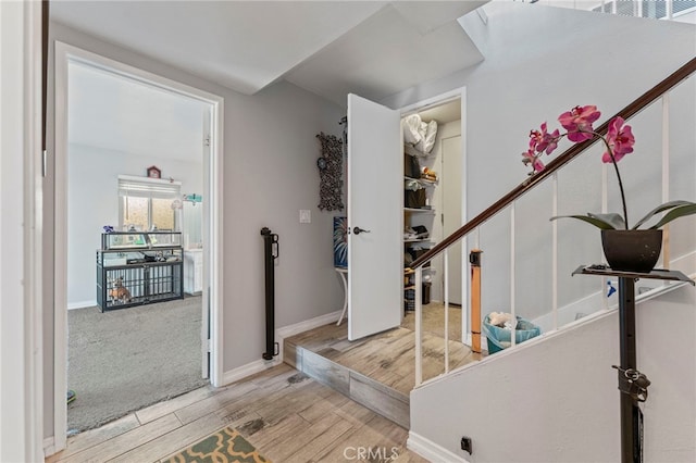 interior space with wood finished floors and baseboards