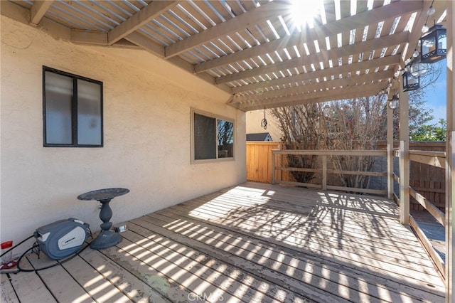 wooden terrace with fence and a pergola