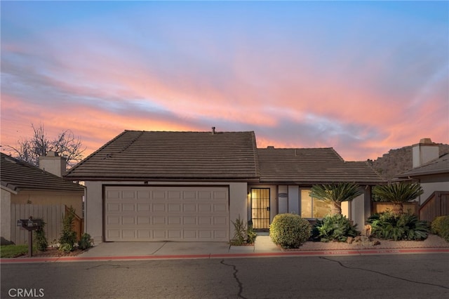 view of front of property with a garage