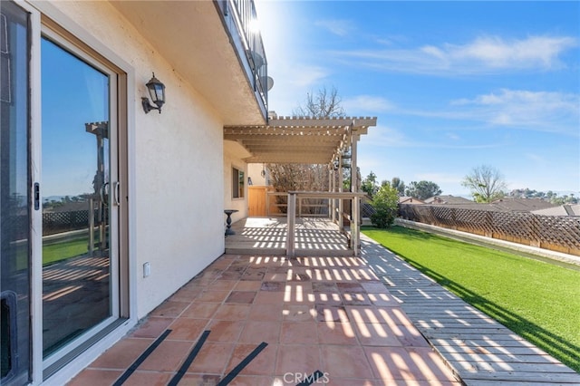 view of patio / terrace featuring fence