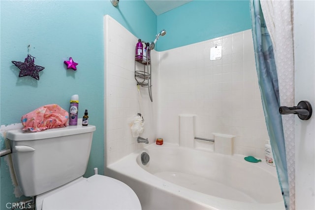 bathroom with shower / tub combo and toilet