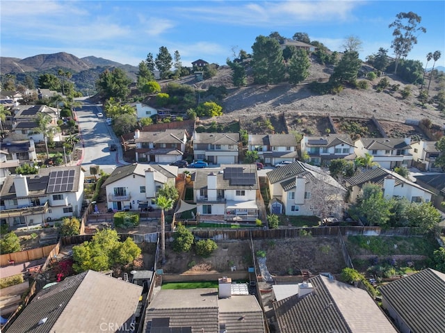 drone / aerial view with a residential view and a mountain view