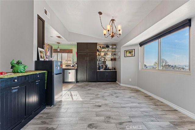 interior space featuring stainless steel appliances, visible vents, hanging light fixtures, an inviting chandelier, and vaulted ceiling