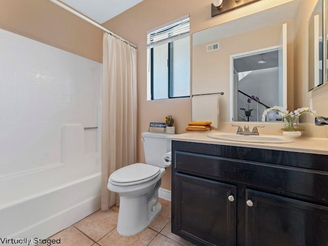 bathroom with shower / bath combo, visible vents, toilet, tile patterned flooring, and vanity