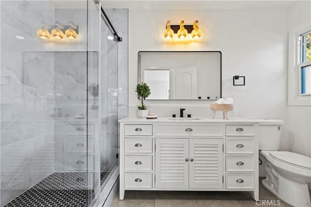 bathroom featuring vanity, an enclosed shower, tile patterned flooring, and toilet