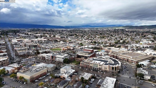 birds eye view of property featuring a mountain view