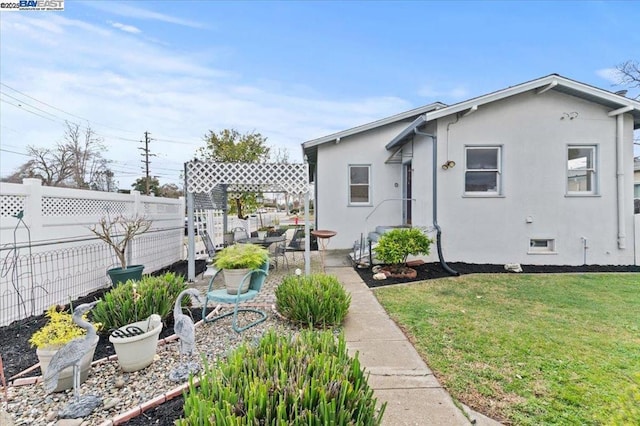 exterior space featuring a patio area and a front lawn