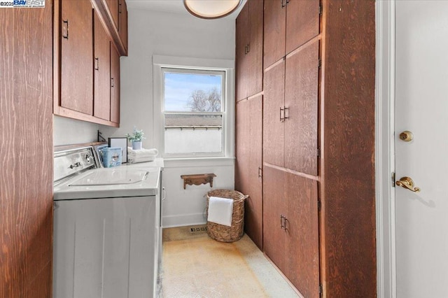 laundry area with cabinets and independent washer and dryer