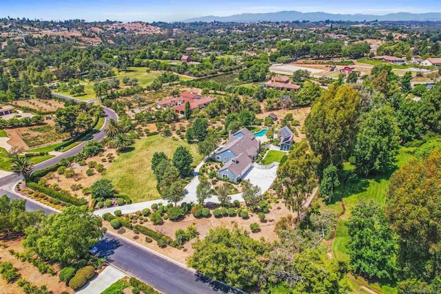 birds eye view of property featuring a mountain view