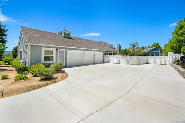 view of property exterior featuring a garage