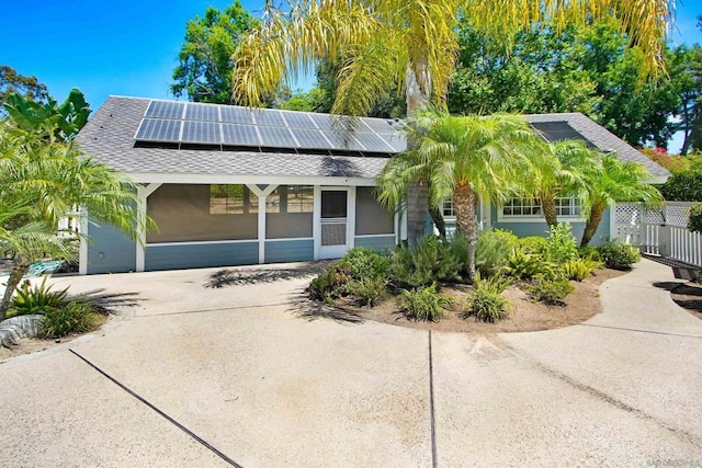 view of front of property with solar panels