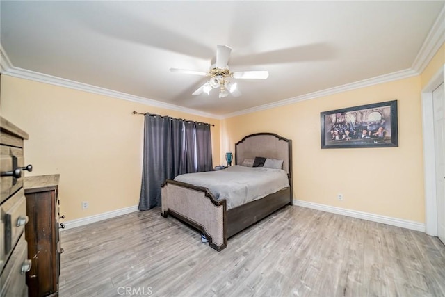 bedroom featuring crown molding, ceiling fan, and light wood-type flooring