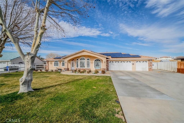 single story home featuring a garage, a front lawn, and solar panels