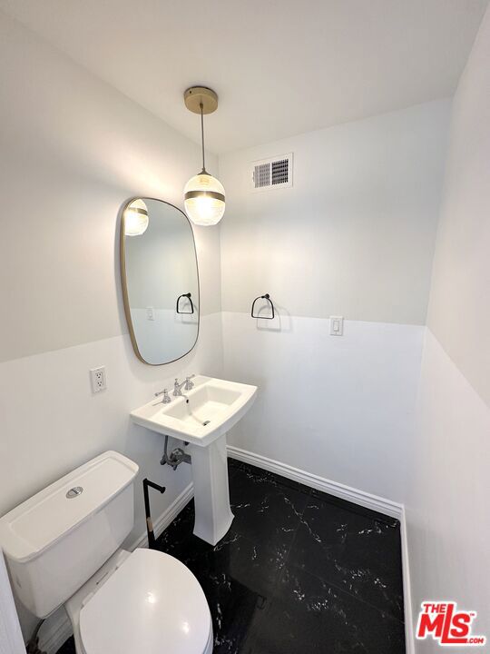 bathroom with toilet and sink