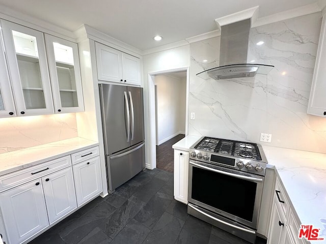 kitchen with stainless steel appliances, island exhaust hood, white cabinets, and light stone counters