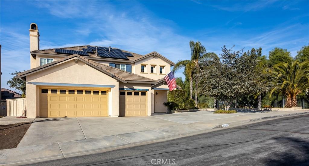 view of front of property with solar panels