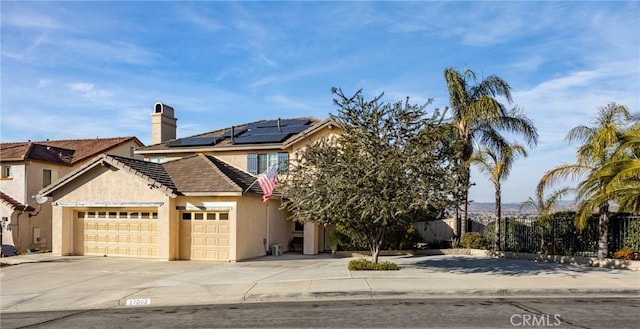 view of front property featuring solar panels