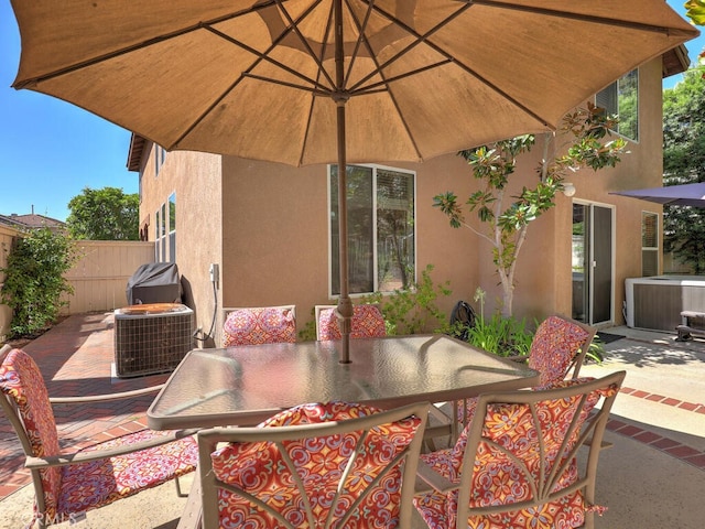 view of patio / terrace featuring outdoor dining space and fence