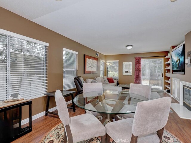 dining space with light hardwood / wood-style floors