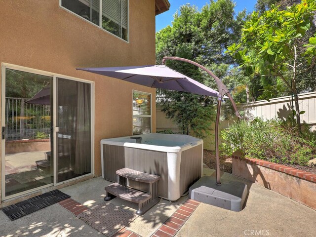 view of patio with a hot tub