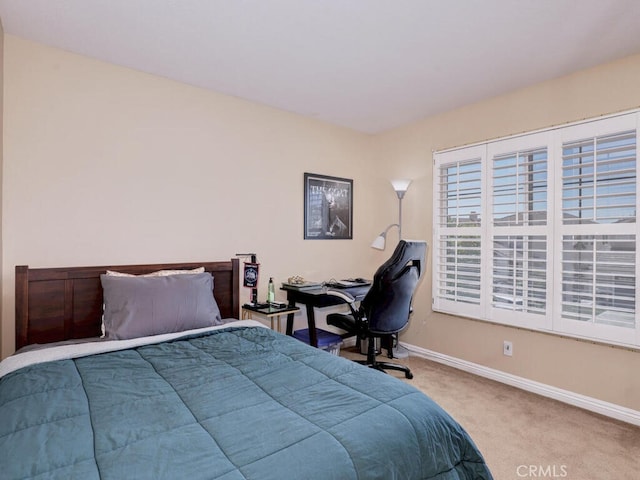 bedroom with light carpet