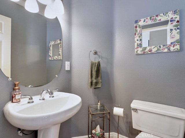 bathroom with toilet and sink