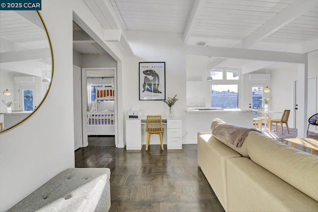 living room with beamed ceiling and dark parquet floors