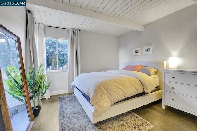 bedroom featuring wood ceiling, beam ceiling, and wood-type flooring