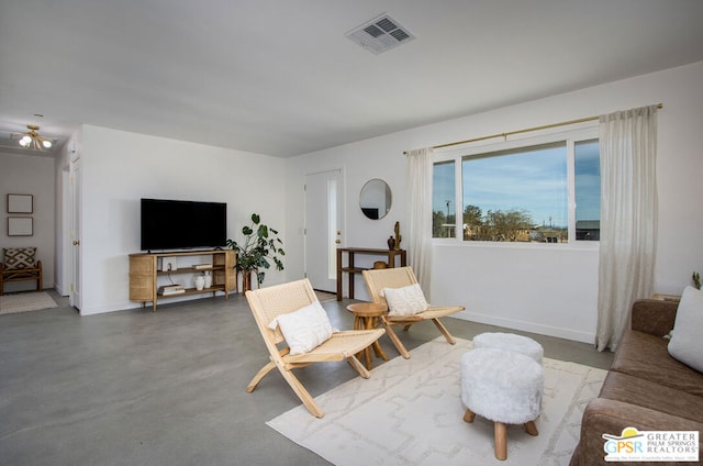 living room featuring concrete flooring