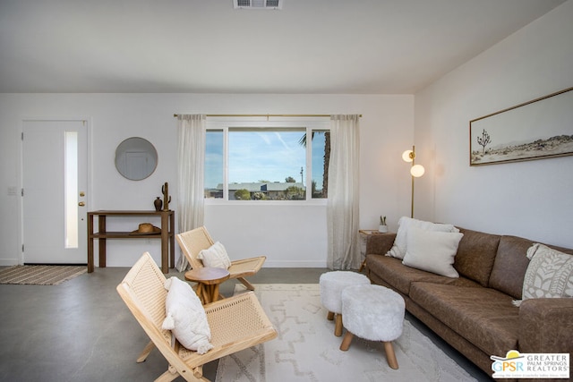 living room featuring concrete floors