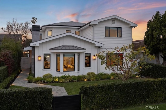 modern farmhouse with a yard