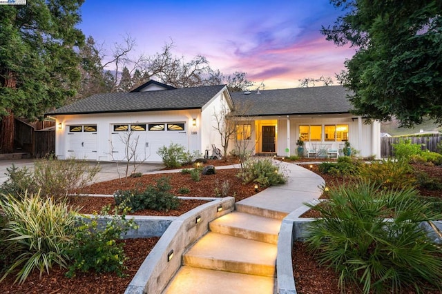 view of front of house with a garage and covered porch