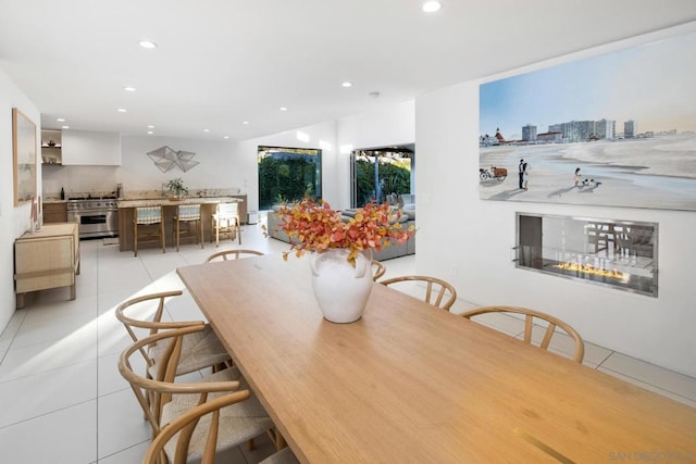 dining space featuring light tile patterned floors