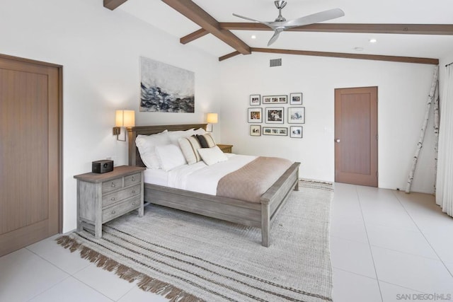 tiled bedroom featuring lofted ceiling with beams and ceiling fan