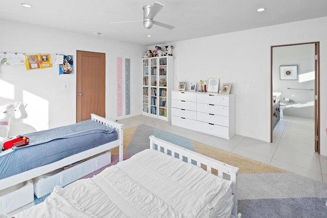 tiled bedroom with ceiling fan