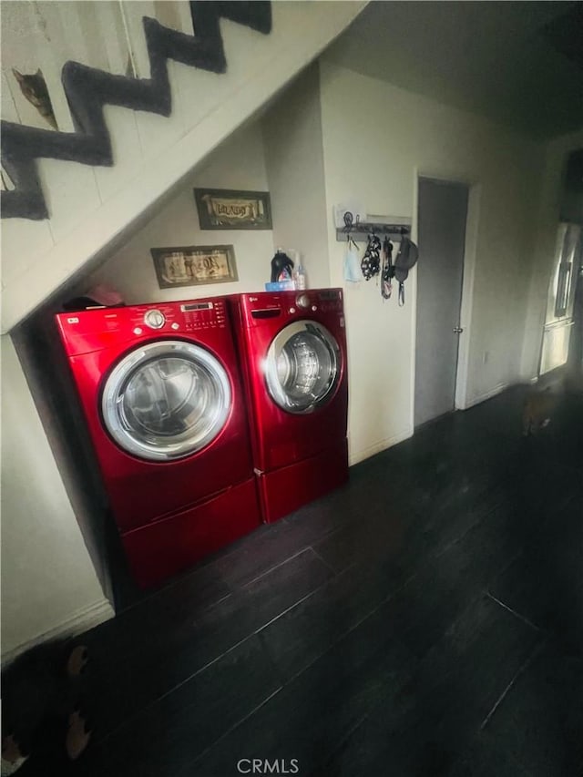 laundry area with hardwood / wood-style flooring and independent washer and dryer