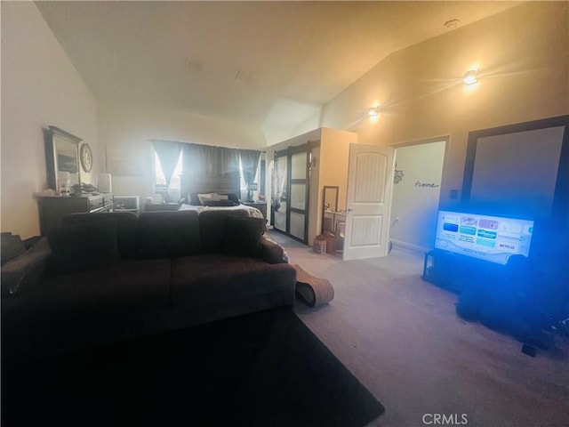 carpeted living room with lofted ceiling