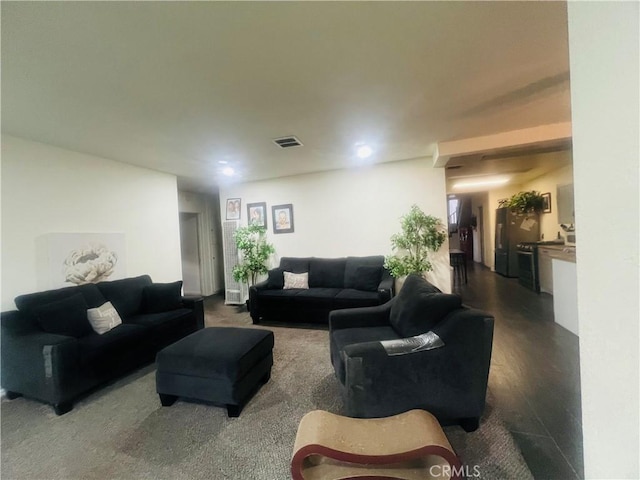 living room with dark hardwood / wood-style floors