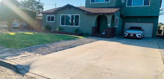 view of front facade with a garage and a front yard