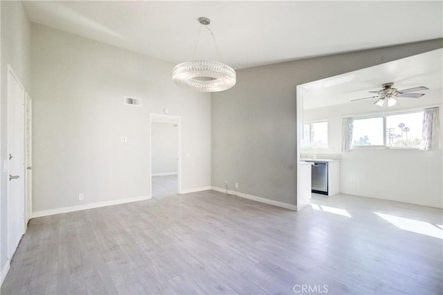 spare room featuring ceiling fan and light hardwood / wood-style floors