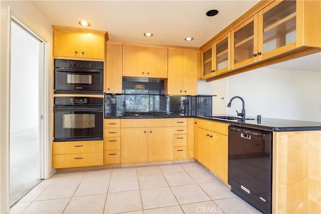 kitchen featuring sink, light tile patterned floors, tasteful backsplash, black appliances, and light brown cabinetry