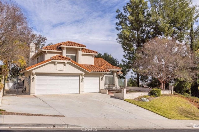 mediterranean / spanish home featuring a garage