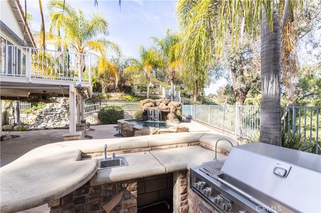 view of patio with area for grilling and grilling area