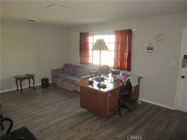 home office with dark hardwood / wood-style flooring