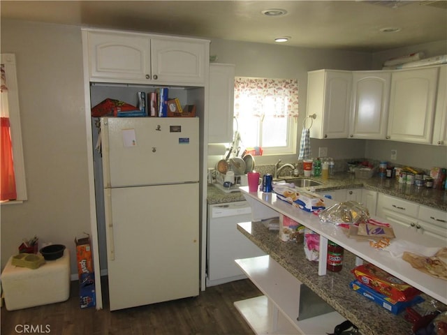 kitchen featuring sink, white appliances, light stone countertops, and white cabinets