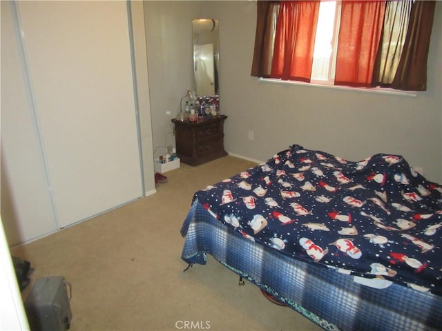 bedroom with light colored carpet