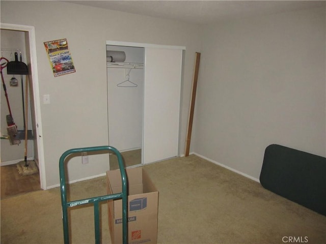 carpeted bedroom with a closet