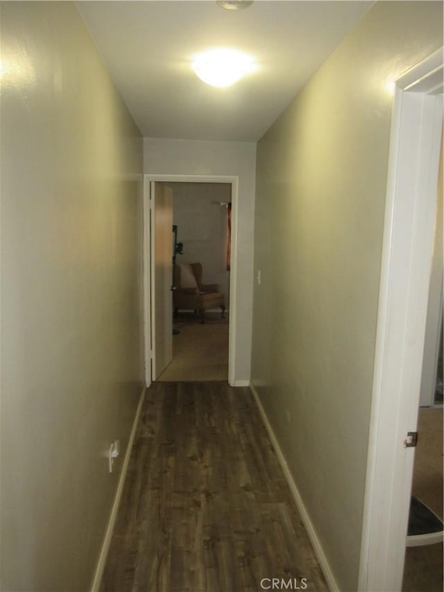 hallway featuring dark hardwood / wood-style flooring