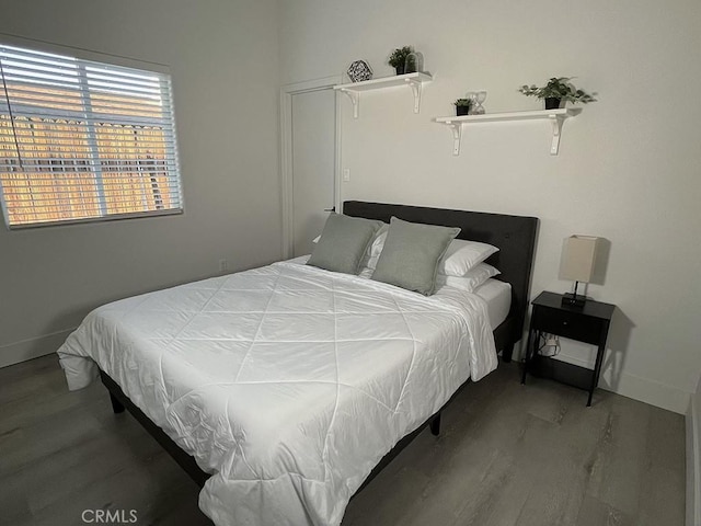 bedroom featuring wood-type flooring