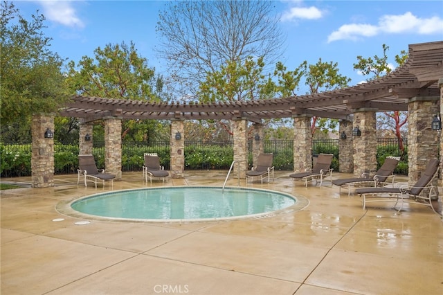 view of swimming pool featuring a patio area and a pergola